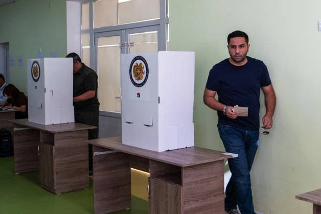 (260607) -- YEREVAN, June 7, 2026 -- A man prepares to cast his ballot at a polling station in Yerevan, Armenia, June 7, 2026. Voting began on Sunday in Armenia s parliamentary elections, with more than 2.48 million registered voters eligible to cast ballots at 2,005 polling stations across the country. Polling stations opened at 8:00 a.m. local time (0400 GMT) and will close at 8:00 p.m. local time. ) ARMENIA-YEREVAN-PARLIAMENTARY ELECTIONS-VOTING ChenxJunfeng 