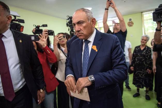(260607) -- YEREVAN, June 7, 2026 -- Armenian Prime Minister Nikol Pashinyan prepares to cast his ballot at a polling station in Yerevan, Armenia, June 7, 2026. Voting began on Sunday in Armenia s parliamentary elections, with more than 2.48 million registered voters eligible to cast ballots at 2,005 polling stations across the country. Polling stations opened at 8:00 a.m. local time (0400 GMT) and will close at 8:00 p.m. local time. ) ARMENIA-YEREVAN-PARLIAMENTARY ELECTIONS-VOTING ChenxJunfeng 