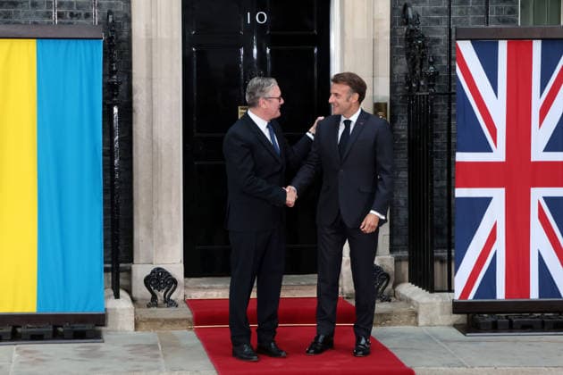 British Prime Minister Keir Starmer greets French President Emmanuel Macron at No.10 Downing Street in London on Sunday June 07, 2025. Starmer Merz, Macron and Zelensky are meeting together to discuss peace in Ukraine.  LON2026060716 HUGOxPHILPOTT