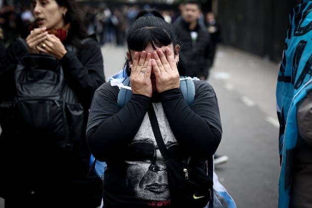 June 7, 2026, Buenos Aires, Argentina: A fan reacts as they wait to pay their respects to singer Carlos Indio Solari during his funeral ceremony. The Argentine rock musician Carlos Alberto Solari known as Indio Solari, who was a member of the band Patricio Rey y sus Redonditos de Ricota, died on June 5 at his home in Parque Leloir. Buenos Aires Argentina  - ZUMAs197 20260607_aaa_s197_571 Copyright: xRobertoxTuerox