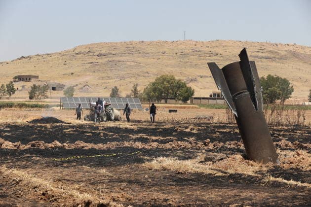 Israeli interception of Iranian missile damages farmers crops in rural Damascus NECHA, SYRIA - JUNE 08: Farmers inspect a fragment of an Iranian ballistic missile embedded in an agricultural field in the Necha area of rural Damascus, Syria, on June 08, 2026. The debris fell onto farmland after the missile was intercepted, sparking a fire that damaged crops and scorched agricultural land. Izz Aldien Alqasem Anadolu Necha Syria. Editorial use only. Please get in touch for any other usage.  Copyright: x2026xAnadoluxIzzxAldienxAlqasemx