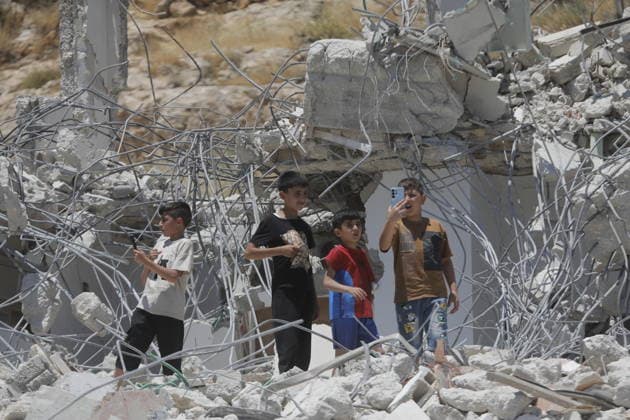 Israeli Forces Demolish Palestinian Home and Workshop Near Hebron Israeli bulldozers demolish the two-story home of Palestinian resident Nayef Abu Sneineh and a carpentry workshop in the Khirbet Qalqas area south of Hebron in the occupied West Bank, on June 8, 2026, as Palestinians inspect the rubble and damage at the site. Photo by Mamoun Wazwaz apaimages Hebron West Bank Palestinian Territory 080626_Hebron_MW_01(26) Copyright: xapaimagesxMamounxWazwazx xapaimagesx