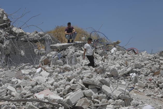 Israeli Forces Demolish Palestinian Home and Workshop Near Hebron Israeli bulldozers demolish the two-story home of Palestinian resident Nayef Abu Sneineh and a carpentry workshop in the Khirbet Qalqas area south of Hebron in the occupied West Bank, on June 8, 2026, as Palestinians inspect the rubble and damage at the site. Photo by Mamoun Wazwaz apaimages Hebron West Bank Palestinian Territory 080626_Hebron_MW_01(32) Copyright: xapaimagesxMamounxWazwazx xapaimagesx