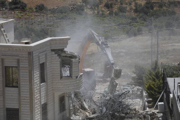 Israeli Forces Demolish Palestinian Home and Workshop Near Hebron Israeli bulldozers demolish the two-story home of Palestinian resident Nayef Abu Sneineh and a carpentry workshop in the Khirbet Qalqas area south of Hebron in the occupied West Bank, on June 8, 2026, as Palestinians inspect the rubble and damage at the site. Photo by Mamoun Wazwaz apaimages Hebron West Bank Palestinian Territory 080626_Hebron_MW_01(4) Copyright: xapaimagesxMamounxWazwazx xapaimagesx