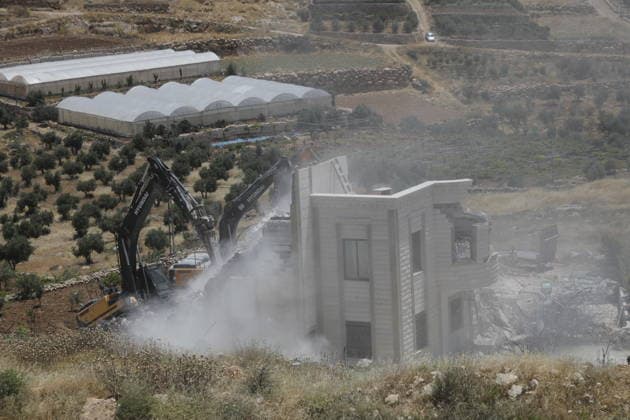 Israeli Forces Demolish Palestinian Home and Workshop Near Hebron Israeli bulldozers demolish the two-story home of Palestinian resident Nayef Abu Sneineh and a carpentry workshop in the Khirbet Qalqas area south of Hebron in the occupied West Bank, on June 8, 2026, as Palestinians inspect the rubble and damage at the site. Photo by Mamoun Wazwaz apaimages Hebron West Bank Palestinian Territory 080626_Hebron_MW_01(7) Copyright: xapaimagesxMamounxWazwazx xapaimagesx