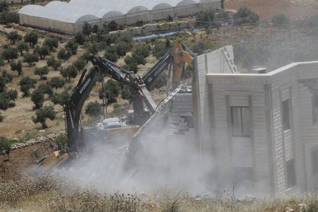 Israeli Forces Demolish Palestinian Home and Workshop Near Hebron Israeli bulldozers demolish the two-story home of Palestinian resident Nayef Abu Sneineh and a carpentry workshop in the Khirbet Qalqas area south of Hebron in the occupied West Bank, on June 8, 2026, as Palestinians inspect the rubble and damage at the site. Photo by Mamoun Wazwaz apaimages Hebron West Bank Palestinian Territory 080626_Hebron_MW_01(8) Copyright: xapaimagesxMamounxWazwazx xapaimagesx
