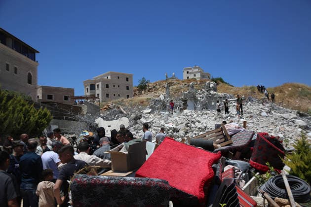 Israeli army demolishes Palestinian home in West Bank, leaving 5 homeless HEBRON, WEST BANK, PALESTINE - JUNE 08: Palestinians gather on the debris of a 2-story Palestinian house, belonging to Nayif Abu Sneineh, after it was demolished by Israeli army heavy machinery, leaving five family members homeless in Qalqas village, south of the West Bank city of Hebron, Palestine on June 08, 2026. Wisam Hashlamoun Anadolu Hebron West Bank. Editorial use only. Please get in touch for any other usage.  Copyright: x2026xAnadoluxWisamxHashlamounx