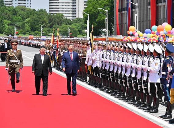 (260608) -- PYONGYANG, June 8, 2026 -- Xi Jinping, general secretary of the Communist Party of China Central Committee and Chinese president, accompanied by Kim Jong Un, general secretary of the Workers Party of Korea and president of the State Affairs of the Democratic People s Republic of Korea (DPRK), inspects the honor guard of the three services of the Korean People s Army in Pyongyang, the DPRK, June 8, 2026. Kim held a grand welcome ceremony for Xi at Kim Il Sung Square in Pyongyang. ) DPRK-PYONGYANG-CHINA-XI JINPING-KIM JONG UN-WELCOME CEREMONY ZhaixJianlan 