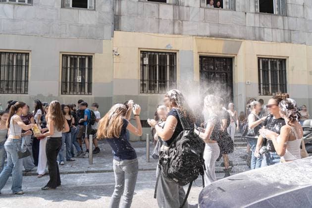 IPA85483579 - Milan, 8 6 26, Liceo Parini, last day of school, boys celebrate with foam, flour and water guns and smoke bombs.  Copyright: xGiuliaxSciaccax xGiuliaxSciaccax 85483579