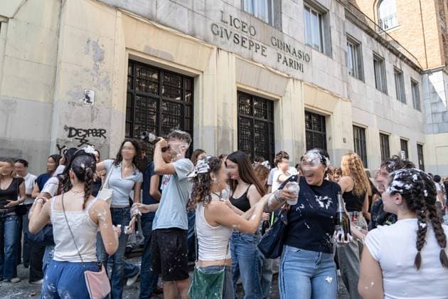 IPA85483609 - Milan, 8 6 26, Liceo Parini, last day of school, boys celebrate with foam, flour and water guns and smoke bombs.  Copyright: xGiuliaxSciaccax xGiuliaxSciaccax 85483609