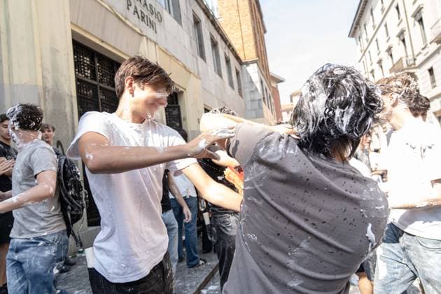 IPA85483628 - Milan, 8 6 26, Liceo Parini, last day of school, boys celebrate with foam, flour and water guns and smoke bombs.  Copyright: xGiuliaxSciaccax xGiuliaxSciaccax 85483628