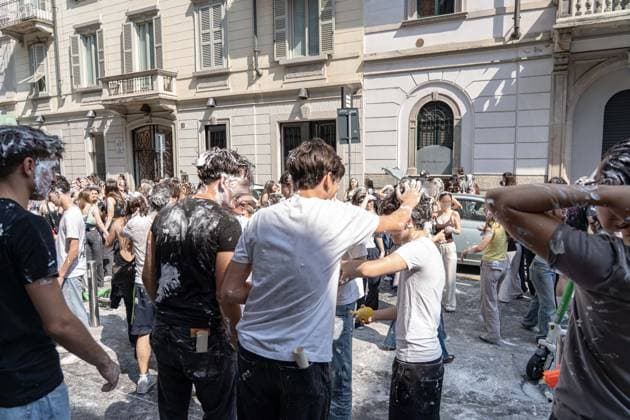 IPA85483631 - Milan, 8 6 26, Liceo Parini, last day of school, boys celebrate with foam, flour and water guns and smoke bombs.  Copyright: xGiuliaxSciaccax xGiuliaxSciaccax 85483631