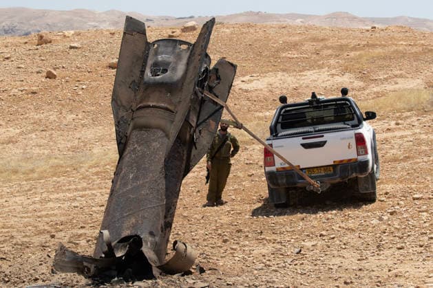 An Israeli soldier watches as they begin to remove an Iranian ballistic missile sticking out from the desert landscape in the area near Jericho, in the West Bank on Monday, June 8, 2026 after it was intercepted by Israel and fell to the desert. Iran fired barrages of missiles and Israel carried out military strikes on both Beirut and Iran. Both Iran and Israel have signaled they would wind down the military escalation that shattered the two month ceasefire.  ISR20260608006 JimxHollander