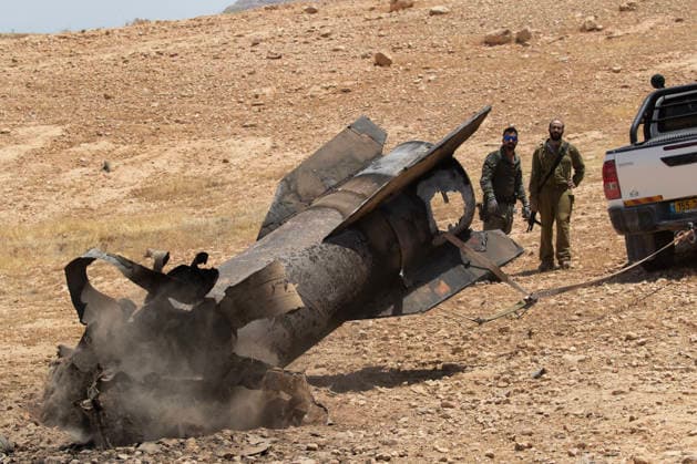 Israeli Border Police and a soldier removing the remains of an Iranian ballistic from the desert landscape in the area near Jericho, in the West Bank on Monday, June 8, 2026 after it was intercepted by Israel and fell to the desert. Iran fired barrages of missiles and Israel carried out military strikes on both Beirut and Iran. Both Iran and Israel have signaled they would wind down the military escalation that shattered the two month ceasefire.  ISR20260608011 JimxHollander