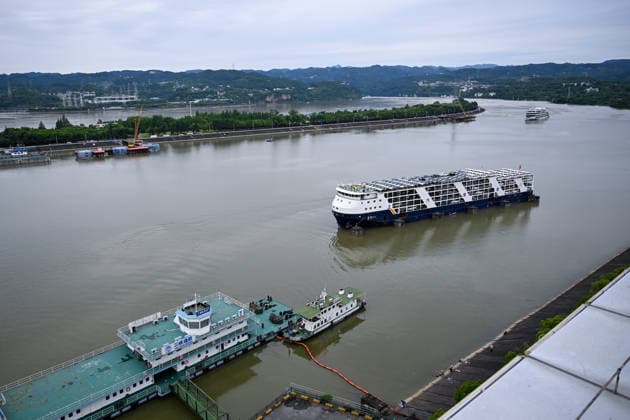 (260608) -- YICHANG, June 8, 2026 -- This photo taken on June 8, 2026 shows the upgrading site of navigation facilities at Gezhouba in Yichang, central China s Hubei Province. China on Monday began construction of a mega waterway project, including what is expected to become the world s largest inland ship lock, in response to the rising shipping demand along the Yangtze, the world s third-longest river. The 77.2-billion-yuan (about 11.3 billion U.S. dollars) project will add a five-tier, dual-track ship lock north of the existing lock at the Three Gorges Dam, the world s largest water conservancy project, and upgrade navigation facilities at a smaller downstream dam. The new ship lock and its approach channels, which together stretc 