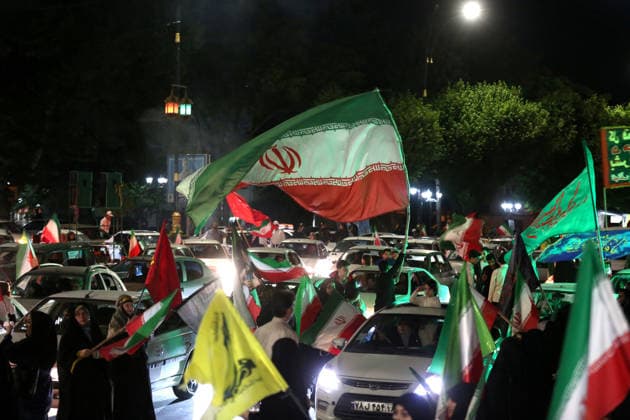 June 8, 2026, Iran, Iran: Supporters wave Iranian national flags from cars during a nighttime state-organized rally. Air raid sirens sounded in Israel on June 7 as its military worked to intercept incoming Iranian missiles for the first time since an April ceasefire took hold in the Middle East war. IranÃ¢â‚¬â ¢s Revolutionary Guards called the attack a Ã¢â‚¬oewarningÃ¢â‚¬Â after Israel struck BeirutÃ¢â‚¬â ¢s southern suburbs earlier in the day, while Tehran said the renewed hostilities would affect ongoing peace talks with Washington. Iran said on June 8 it was ending its latest military operation against Israel after overnight missile fire and Israeli strikes on military sites in the Islamic Republic, but warned it could deliver a more Ã - ZUMAi98_ 20260608_zih_i98_003 Copyright: xIranianxSupremexLeader SxOfficex