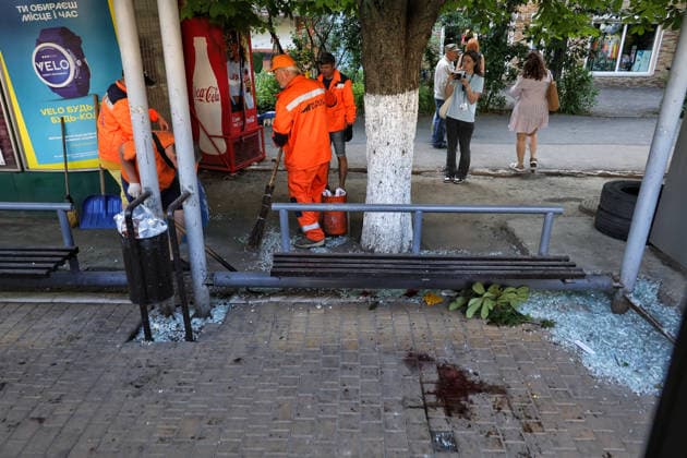 Blood covers the ground at a public transport stop as municipal workers sweep away glass shards after a Russian drone attack, Odesa, Ukraine, June 8, 2026. Russian forces attacked the southern Ukrainian city with Shahed-type drones. The wreckage of a downed drone fell directly onto a public transport stop, damaging the stop itself, as well as a control room, and several shared taxis. Three people were injured. (Photo by Nina Liashonok Ukrinform) Russian troops attack Odesa and region with drones  Copyright: xNinaxLiashonokx
