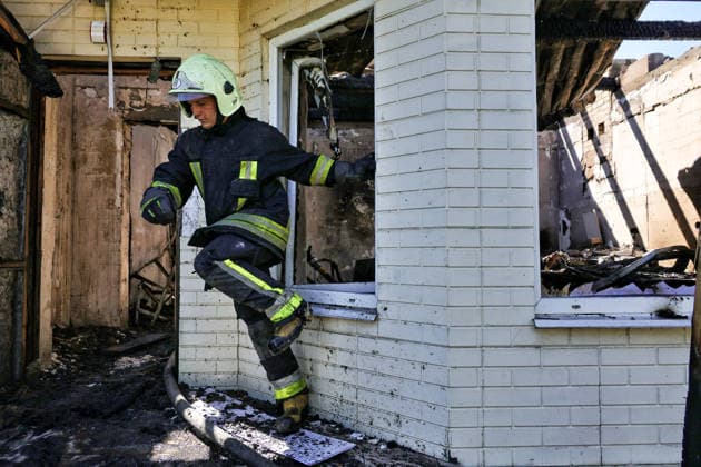 A rescuer steps through a window in a fire-stricken house damaged by a Russian drone attack, Oleksandrivka village, Odesa region, Ukraine, June 8, 2026. (Photo by Nina Liashonok Ukrinform) Russian troops attack Odesa and region with drones  Copyright: xNinaxLiashonokx