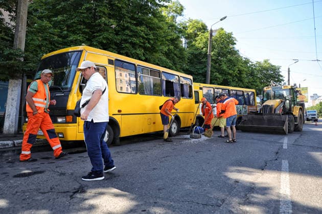 Municipal workers sweep away glass shards near shared taxis after a Russian drone attack, Odesa, Ukraine, June 8, 2026. Russian forces attacked the southern Ukrainian city with Shahed-type drones. The wreckage of a downed drone fell directly onto a public transport stop, damaging the stop itself, as well as a control room, and several shared taxis. Three people were injured. (Photo by Nina Liashonok Ukrinform) Russian troops attack Odesa and region with drones  Copyright: xNinaxLiashonokx