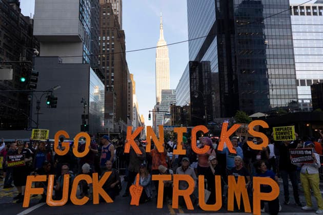 June 8, 2026, New York, New York, USA: Protesters hold letters that read GO KNICKS FUCK TRUMP, signs that read IMPEACH CONVICT REMOVE outside Madison Square Garden as fans enter the stadium for game 3 of the NBA finals. Security is high in Midtown Manhattan with street closures, portable fences, barricades and heavy police presence for President Trump s attendance at the basketball game. New York USA - ZUMAr174 20260608_znp_r174_004 Copyright: xGinaxMxRandazzox