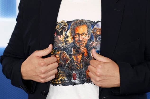 A guest wears a shirt with an image of Steven Spielberg and his films when arriving on the red carpet at the Disclosure Day New York Premiere at David H. Koch Theater at Lincoln Center on Monday, June 8, 2026 in New York City.  NYP20260608111 JohnxAngelillo