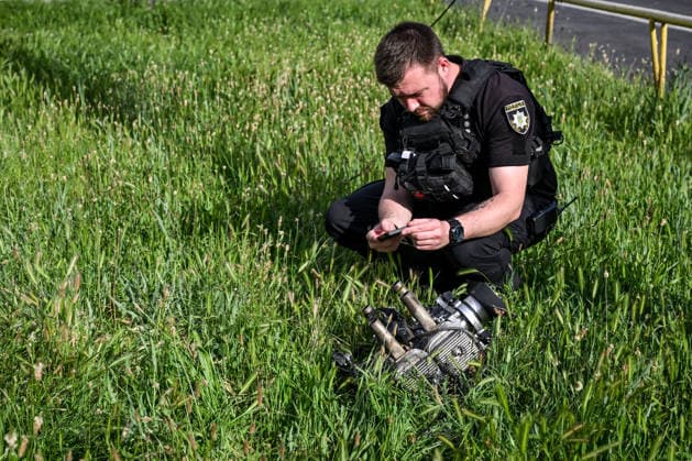 A police officer photographs the engine of a Russian drone that struck near a public transport stop in Zaporizhzhia, Ukraine, on June 8, 2026. Russian occupation forces carried out a drone attack on the civilian infrastructure of the southeastern city. The drone hit a residential area, with the explosion occurring near a public transport stop. The blast wave and debris significantly damaged nearby apartment blocks, destroyed and damaged shopping stalls and cars. The impact claimed the lives of two women who were in the zone of the strike. Twenty-four people were injured, including five children and two teenagers. (Photo by Dmytro Smolienko Ukrinform) Deadly Russian drone attack on residential area in Zaporizhzhia  Copyright: xDmytroxSmolienkox