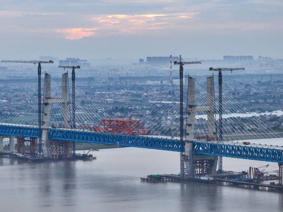 (260609) -- NANTONG, June 9, 2026 -- A drone photo taken on June 9, 2026 shows a view of the Chongqi Highway-Railway Bridge over the Yangtze River between east China s Shanghai and Jiangsu. A key project of the Shanghai-Chongqing-Chengdu high-speed railway, the Chongqi Highway-Railway Bridge was successfully closed here on Tuesday. It has a total length of 4.09 kilometers and a main span of 400 meters. Once opened to traffic, the bridge will reduce the travel time between Shanghai and Qidong of Jiangsu from two and a half hours to less than half an hour. ) CHINA-SHANGHAI-JIANGSU-CHONGQI HIGHWAY-RAILWAY BRIDGE OVER YANGTZE RIVER (CN) JixChunpeng 