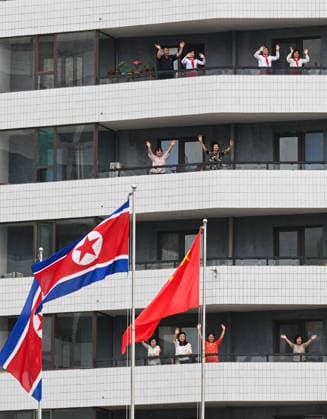(260609) -- PYONGYANG, June 9, 2026 -- People from all walks of life bid farewell to Xi Jinping, general secretary of the Communist Party of China Central Committee and Chinese president, in Pyongyang, the Democratic People s Republic of Korea (DPRK), June 9, 2026. On Tuesday afternoon local time, Xi concluded his state visit to the DPRK and departed from Pyongyang. Kim Jong Un, general secretary of the Workers Party of Korea and president of the State Affairs of the DPRK, and his wife Ri Sol Ju went to the airport to see Xi and his wife Peng Liyuan off and held a grand farewell ceremony in their honor. ) DPRK-PYONGYANG-CHINA-XI JINPING-KIM JONG UN-GRAND FAREWELL CEREMONY XiexHuanchi 