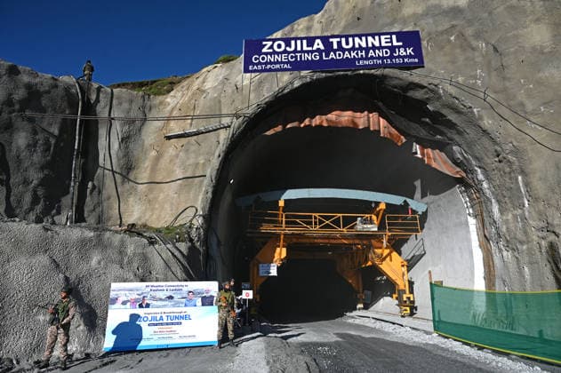 DRASS, INDIA - JUNE 9: Paramilitary soldiers stand guard at East Portal of Zojila Tunnel after the historic breakthrough ceremony of the Zojila Tunnel at Meenamarg on June 9, 2026 in Drass, India. Build at the cost of Rs 6000 Cr. the 13.15 KM tunnel is now the world s longest single-tube, bi-directional road tunnel at an elevation exceeding 11,500 feet. The historic breakthrough brings a decades-old national security dream closer to reality. For generations, the treacherous Zojila Pass on National Highway 1 (NH-1) has functioned as a severe logistical bottleneck, shutting down completely for three to four months during peak winter due to heavy avalanches, massive snow accumulation, and sub-zero structural icing.(Photo by Waseem Andrabi Hin