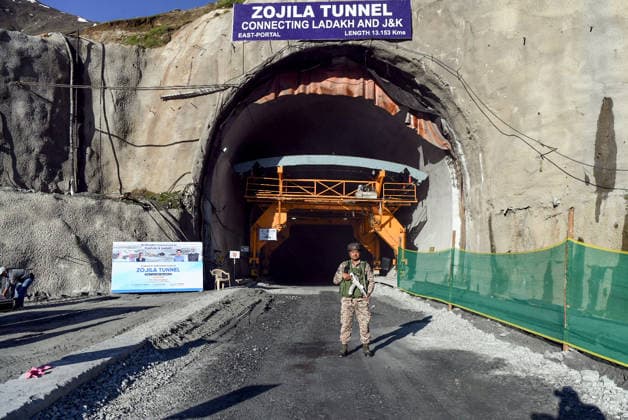 Final Breakthrough Ceremony of the Zojila Tunnel Kargil Ladakh , Jun 09 (ANI): A security official stands guard during the final breakthrough ceremony of the world s longest single-tube bidirectional Zojila Tunnel, graced by Union Road Transport and Highways Minister Nitin Gadkari, Jammu and Kashmir Chief Minister Omar Abdullah, and state Lieutenant Governor Manoj Sinha at Minamarg, in Kargil on Tuesday. Kargil Ladakh India Copyright: xANIx ANI_20260609063