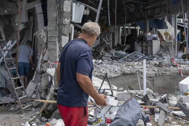 Aftermath of Russian attack on Ukraine s Chuhuiv CHUHUIV, KHARKIV REGION, UKRAINE - JUNE 9: Local residents clean the damage caused by the Russian missile strike on Chuhuiv, Kharkiv Region, Ukraine on June 9, 2026.Three people were killed in the missile attack on Chuhuiv: two men, aged 56 and 70, and a 22-year-old pregnant woman. Medical personnel provided assistance to two women, aged 71 and 65, and a 70-year-old man who suffered acute stress reactions. Two buildings, stores, garages, and two cars were damaged. Serhii Masin Anadolu Kharkiv Ukraine. Editorial use only. Please get in touch for any other usage.  Copyright: x2026xAnadoluxSerhiixMasinx