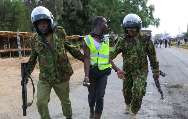 Protest held in Kenya against planned U.S. Ebola quarantine facility NANYUKI, KENYA - JUNE 09: Kenyan police detain a protester during a demonstration against a planned Ebola quarantine facility for U.S. citizens in Nanyuki, central Kenya on June 09, 2026. Dozens of people gathered to protest the facility, blocking a road and setting fires before police intervened to disperse the crowd. Lucas Mukasa Anadolu Nanyuki Kenya. Editorial use only. Please get in touch for any other usage.  Copyright: x2026xAnadoluxLucasxMukasax