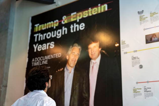 People visit a pop-up exhibit The Donald J. Trump and Jeffrey Epstein Memorial Reading Room featuring a timeline of the relationship between President Donald Trump and convicted sex offender Jeffrey Epstein in Washington, DC on Tuesday, June 9, 2026. The traveling exhibit, run by The Institute of Primary Facts, includes 3,437 bound volumes of documents and photographs released by the Department of Justice on Epstein, who died in 2019.  WAP20260609399 BONNIExCASH