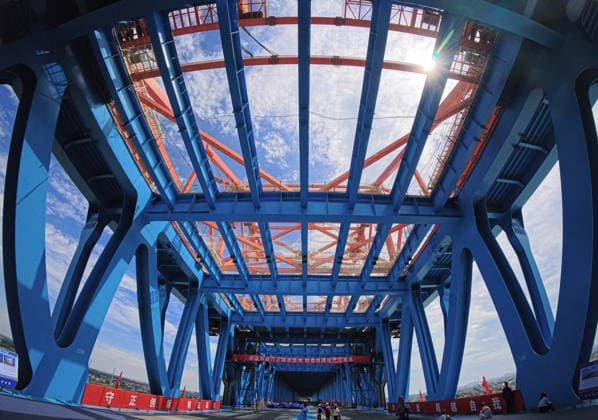 (260610) -- BEIJING, June 10, 2026 -- This photo taken on June 9, 2026 shows an interior view of the Chongqi Highway-Railway Bridge over the Yangtze River between east China s Shanghai and Jiangsu. A key project of the Shanghai-Chongqing-Chengdu high-speed railway, the Chongqi Highway-Railway Bridge was successfully closed here on Tuesday. It has a total length of 4.09 kilometers and a main span of 400 meters. Once opened to traffic, the bridge will reduce the travel time between Shanghai and Qidong of Jiangsu from two and a half hours to less than 30 minutes. ) XINHUA PHOTOS OF THE DAY FangxZhe 