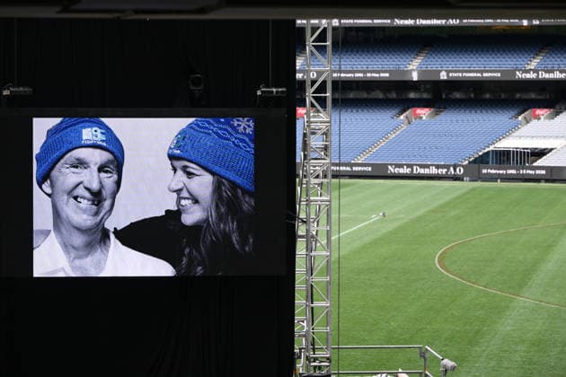 NEALE DANIHER STATE FUNERAL, An image of Neale and Bec Daniher on a screen during a State Funeral Service for Neale Daniher at the MCG, Melbourne, Wednesday, June 10, 2026. A state funeral will honour the life and extraordinary achievements of AFL great Neale Daniher, whose fight against MND inspired countless Australians. ( NO ARCHIVING MELBOURNE VICTORIA AUSTRALIA  Copyright: xJOELxCARRETTx 20260610174961412002