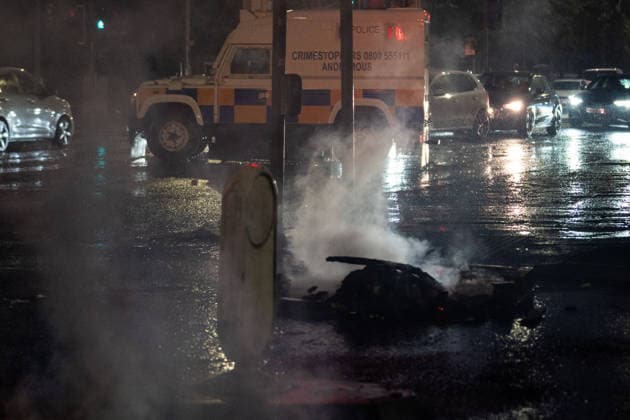 June 9, 2026, Belfast, Antrim, United Kingdom: Police van drives past a blockaded road during the rally. Belfast erupted into flames as locals took to the streets to protest against the stabbing of a North Belfast man by a Sudanese national refugee. Road blockades were set up all over Belfast bringing much of the city to a standstill. The protestors are demanding a stop to immigration into Northern Ireland. Belfast United Kingdom - ZUMAs197 20260609_aaa_s197_282 Copyright: xLabxMox