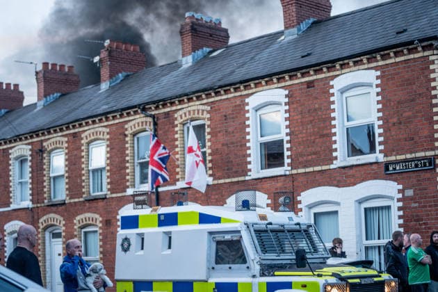 June 9, 2026, Belfast, Antrim, United Kingdom: Riot Police arrive at the scene of a fire lit by anti-immigration protestors in Belfast. Belfast erupted into flames as locals took to the streets to protest against the stabbing of a North Belfast man by a Sudanese national refugee. Road blockades were set up all over Belfast bringing much of the city to a standstill. The protestors are demanding a stop to immigration into Northern Ireland. Belfast United Kingdom - ZUMAs197 20260609_aaa_s197_295 Copyright: xLabxMox