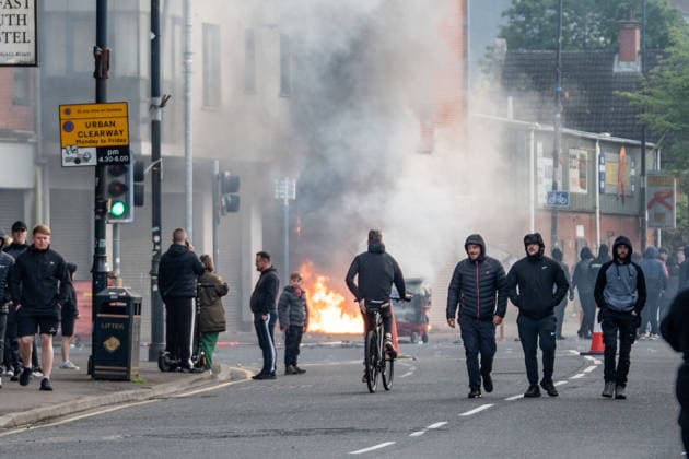 June 9, 2026, Belfast, Antrim, United Kingdom: Belfast youths burn down a grocery store owned by an immigrant during the rally. Belfast erupted into flames as locals took to the streets to protest against the stabbing of a North Belfast man by a Sudanese national refugee. Road blockades were set up all over Belfast bringing much of the city to a standstill. The protestors are demanding a stop to immigration into Northern Ireland. Belfast United Kingdom - ZUMAs197 20260609_aaa_s197_297 Copyright: xLabxMox