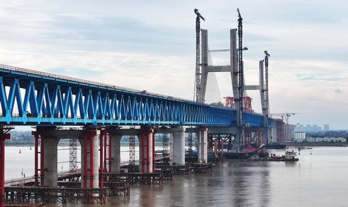 SHANGHAI, CHINA - JUNE 09: A view of the Chongqi Highway-Railway Bridge over the Yangtze River on June 9, 2026 in Shanghai, China. A key project of the Shanghai-Chongqing-Chengdu high-speed railway, the Chongqi Highway-Railway Bridge was successfully closed here on June 9. It has a total length of 4.09 kilometers and a main span of 400 meters. Once opened to traffic, the bridge will reduce the travel time between Shanghai and Qidong of Jiangsu from two and a half hours to less than half an hour.  Copyright: xChinaxNewsxServicex 111647090442