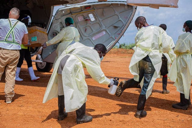 (260610) -- KINSHASA, June 10, 2026 () -- Medical workers in protective suits conduct disinfection work before carrying medical supplies against the Ebola epidemic in Mongbwalu, Ituri province, the Democratic Republic of the Congo, June 9, 2026. The number of confirmed Ebola cases in the Democratic Republic of the Congo (DRC) has risen to 598, including 115 deaths, the country s public health authorities said Tuesday. () (SpotNews) DR CONGO-ITURI-EBOLA OUTBREAK-HEALTH MEASURES Xinhua 