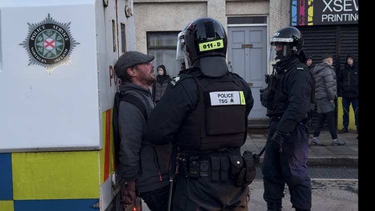 Disorder continues in Belfast after knife attack leaves man seriously injured BELFAST, NORTHERN IRELAND - JUNE 09: Police officers detain a man near an armored police vehicle during unrest on Sandy Row in Belfast, Northern Ireland, on June 9, 2026. Demonstrations followed a knife attack that left a man seriously injured. Disorder continued in Belfast on Wednesday following a knife attack that left a man seriously injured, with police deploying additional officers as unrest spread across several parts of Northern Ireland s capital. Authorities said a 30-year-old man has been charged with attempted murder in connection with Monday night s attack. He also faces charges of possessing a bladed article in a public place and making threats to kill  Copyright: x2026xAnadoluxStringerx