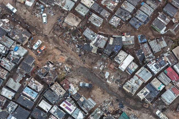 (260610) -- JOHANNESBURG, June 10, 2026 -- An aerial drone photo taken on June 10, 2026 shows the scene of a shooting incident in Cleveland, Johannesburg, South Africa. At least 12 people were killed and nine others injured in a mass shooting at an informal settlement in Johannesburg, South Africa s largest city, police said on Wednesday. (Photo by Shiraaz Mohamed Xinhua) SOUTH AFRICA-JOHANNESBURG-SHOOTING INCIDENT ChenxWei 