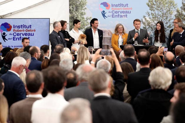 Emmanuel Macron and Brigitte Macron Visit the Robert-Debre Hospital - Paris French President Emmanuel Macron delivers a speech next to Adrien Taquet, Chairman of the Supervisory Board of the Robert-Debre Institute for the Child s Brain and Professor Ghislaine Dehaene during the foundation stone laying ceremony for the Child Brain Institute (ICE - Institut Robert-Debre du Cerveau de l’Enfant) at the Robert-Debre Hospital in Paris, on June 10, 2026. Photo by Stephane Lemouton Pool ABACAPRESS.COM Paris France  Copyright: xLemoutonxStephane Pool ABACAx