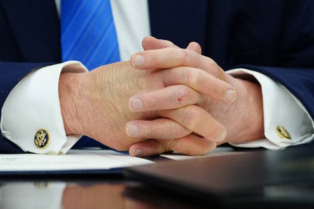 Trump During a Signing Ceremony for the Secure America Act - Washington US President Donald Trump folds his hands during a signing ceremony for the Secure America Act in the Oval Office of the White House in Washington, DC, US, on Wednesday, June 10, 2026. President Donald Trump prevailed after dissident Republican lawmakers abandoned an effort to leverage a $70 billion spending package to prevent him from reviving a payout fund for political allies who say they were unfairly targeted by the Biden administration. Photo by Aaron Schwartz Pool ABACAPRESS.COM  Copyright: xPool ABACAx