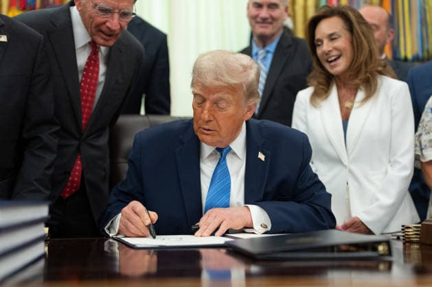 US President Donald Trump signs the Secure America Act in the Oval Office of the White House in Washington, DC, US, on Wednesday, June 10, 2026. President Donald Trump prevailed after dissident Republican lawmakers abandoned an effort to leverage a $70 billion spending package to prevent him from reviving a payout fund for political allies who say they were unfairly targeted by the Biden administration.  WAX20260610207 AaronxSchwartz