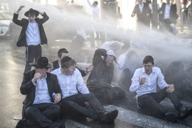 Police intervene as Ultra-Orthodox Jews block roads in West Jerusalem WEST JERUSALEM - JUNE 10: Israeli police use stun grenades and water cannons to disperse Ultra-Orthodox (Haredi) Jews blocking roads during a protest on June 10, 2026. Three demonstrators were detained during the incidents in West Jerusalem, where crowds gathered to protest against compulsory military service. Mostafa Alkharouf Anadolu Jerusalem Israel. Editorial use only. Please get in touch for any other usage.  Copyright: x2026xAnadoluxMostafaxAlkharoufx
