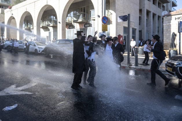 Police intervene as Ultra-Orthodox Jews block roads in West Jerusalem WEST JERUSALEM - JUNE 10: Israeli police use stun grenades and water cannons to disperse Ultra-Orthodox (Haredi) Jews blocking roads during a protest on June 10, 2026. Three demonstrators were detained during the incidents in West Jerusalem, where crowds gathered to protest against compulsory military service. Mostafa Alkharouf Anadolu Jerusalem Israel. Editorial use only. Please get in touch for any other usage.  Copyright: x2026xAnadoluxMostafaxAlkharoufx