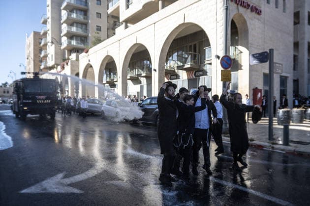 Police intervene as Ultra-Orthodox Jews block roads in West Jerusalem WEST JERUSALEM - JUNE 10: Israeli police use stun grenades and water cannons to disperse Ultra-Orthodox (Haredi) Jews blocking roads during a protest on June 10, 2026. Three demonstrators were detained during the incidents in West Jerusalem, where crowds gathered to protest against compulsory military service. Mostafa Alkharouf Anadolu Jerusalem Israel. Editorial use only. Please get in touch for any other usage.  Copyright: x2026xAnadoluxMostafaxAlkharoufx