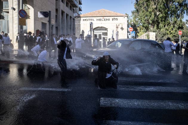 Police intervene as Ultra-Orthodox Jews block roads in West Jerusalem WEST JERUSALEM - JUNE 10: Israeli police use stun grenades and water cannons to disperse Ultra-Orthodox (Haredi) Jews blocking roads during a protest on June 10, 2026. Three demonstrators were detained during the incidents in West Jerusalem, where crowds gathered to protest against compulsory military service. Mostafa Alkharouf Anadolu Jerusalem Israel. Editorial use only. Please get in touch for any other usage.  Copyright: x2026xAnadoluxMostafaxAlkharoufx
