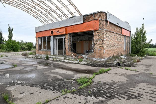 RECORD DATE NOT STATED A gas station destroyed during hostilities is seen along the Mykolaiv–Kherson highway, Ukraine, on June 3, 2026. The Russian army attacks Kherson and the surrounding region daily with FPV drones and other unmanned aerial vehicles, deliberately terrorizing civilians. Russian forces conduct hunts for local residents, tracking them with FPV drones and dropping explosives. Police officers, medics, public transport, and civilian infrastructure are also targeted. Based on the intensity of attacks, Kherson is informally divided into yellow and red zones, with the red zone considered the most dangerous due to constant shelling and drone strikes (Photo by Dmytro Smolienko Ukrinform) Life under shelling in frontline Kherson  Copyright: xDmytroxSmolienkox